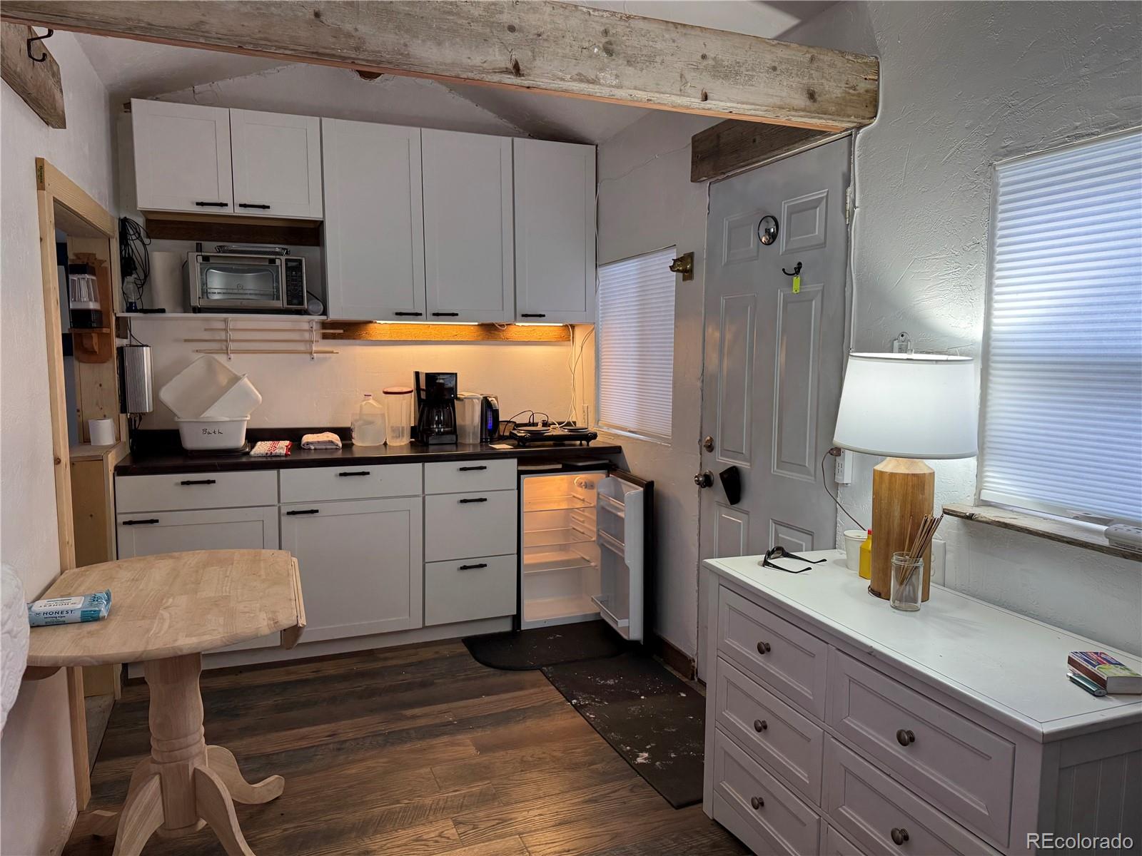 1666 Singletree Road Hartsel, CO 80449 - Photo 6 of 37 a kitchen with a sink appliances and cabinets