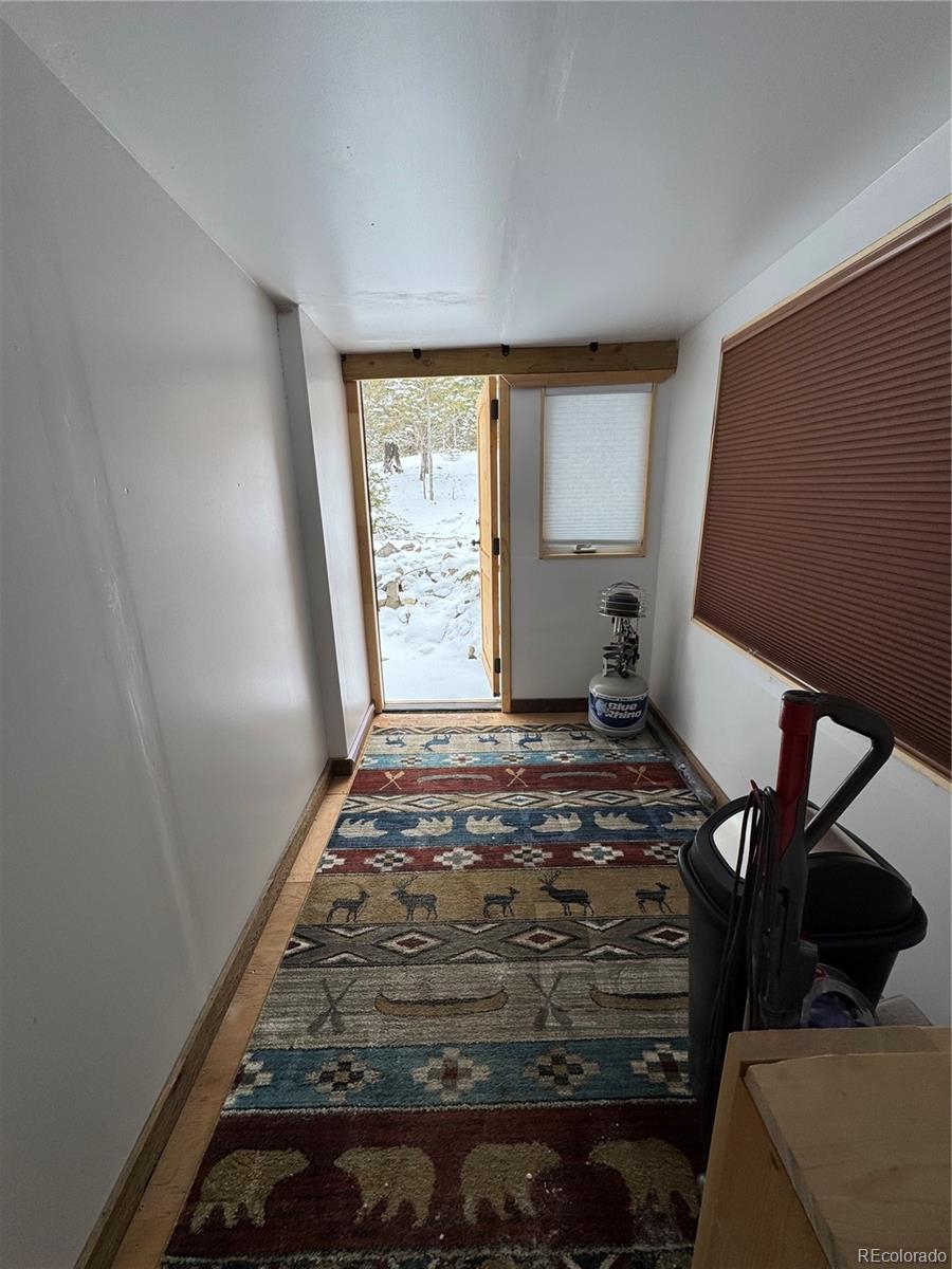 1666 Singletree Road Hartsel, CO 80449 - Photo 9 of 37 a bedroom with a bed and a window