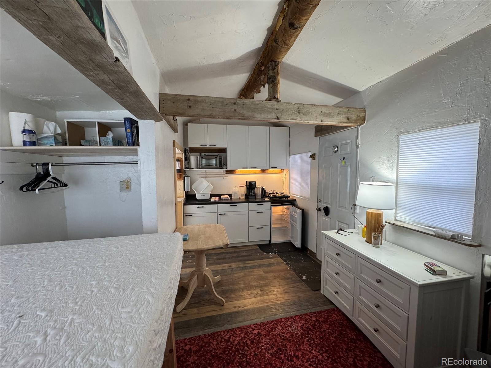 1666 Singletree Road Hartsel, CO 80449 - Photo 10 of 37 a kitchen with stainless steel appliances granite countertop a sink stove and refrigerator
