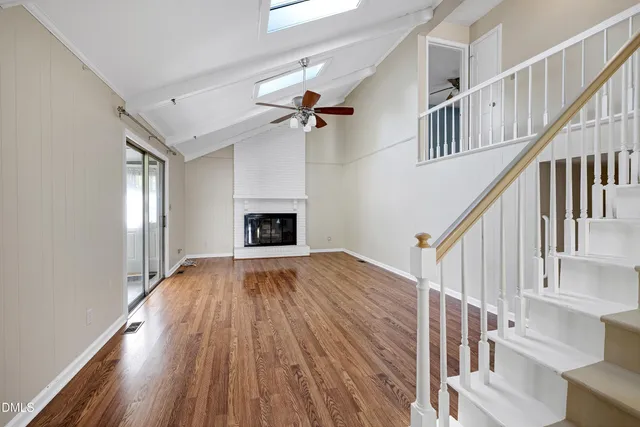 a view of main area wooden floor and staircase