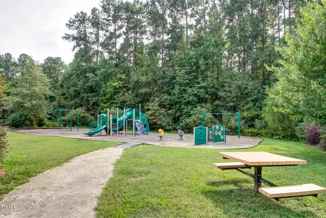 a view of a backyard with swimming pool