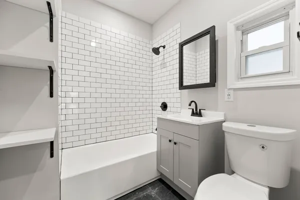 a bathroom with a sink toilet and bathtub