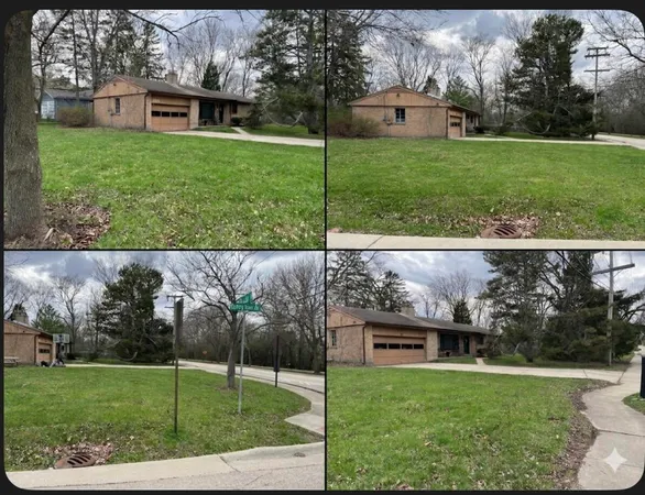 a view of a house with a back yard