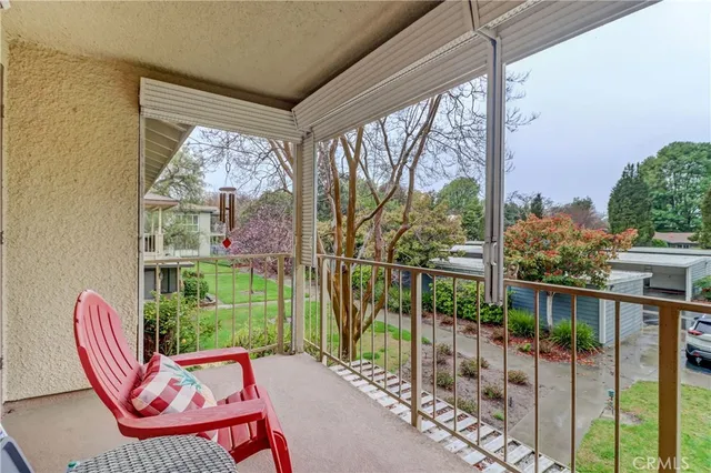 a balcony view with a seating space
