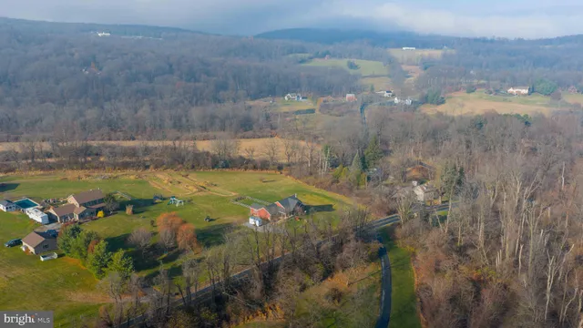 a view of a lake in between of two and trees
