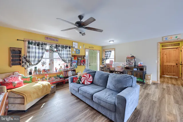 a view of a livingroom with furniture and windows