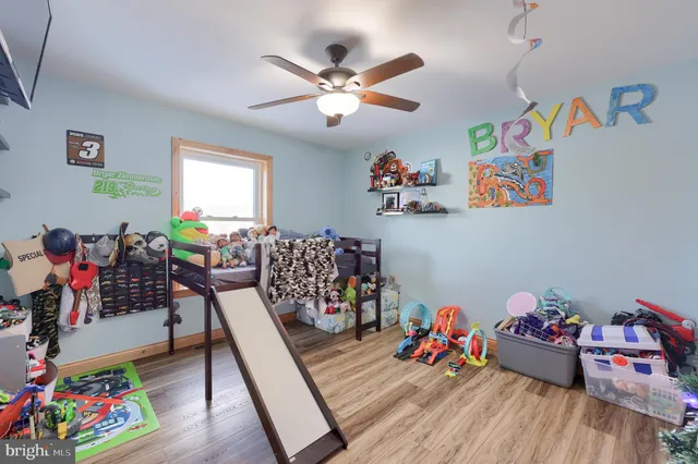 a bedroom with bed and a window