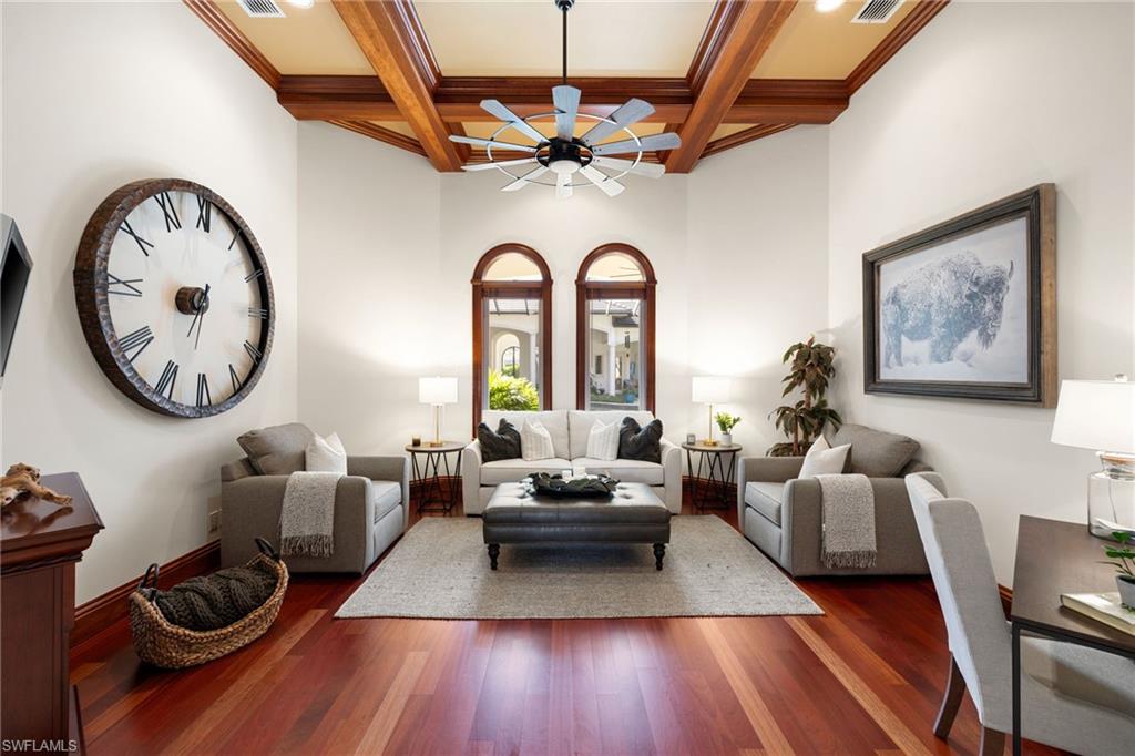 185 Tupelo Road Naples, FL 34108 - Photo 12 of 44 a living room with furniture and a large window