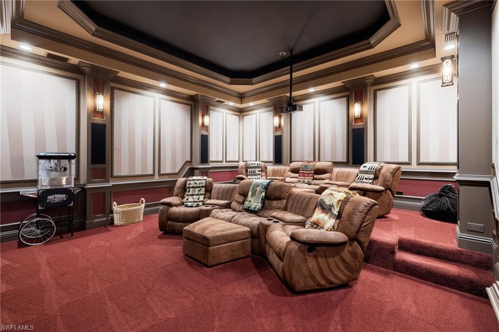 185 Tupelo Road Naples, FL 34108 - Photo 34 of 44 a living room with furniture and a mirror