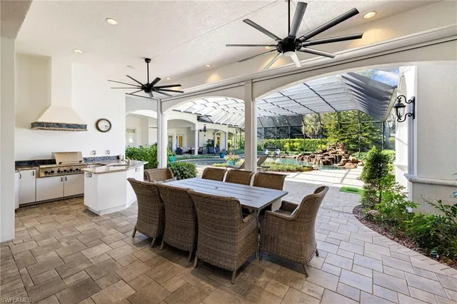 a living room with furniture and a mirror