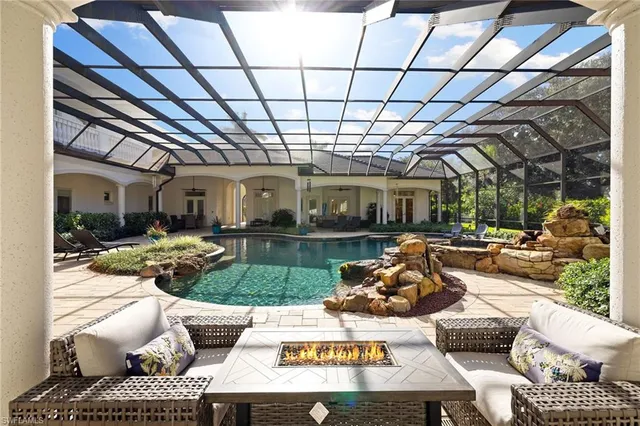 a outdoor living space with furniture and a black umbrella