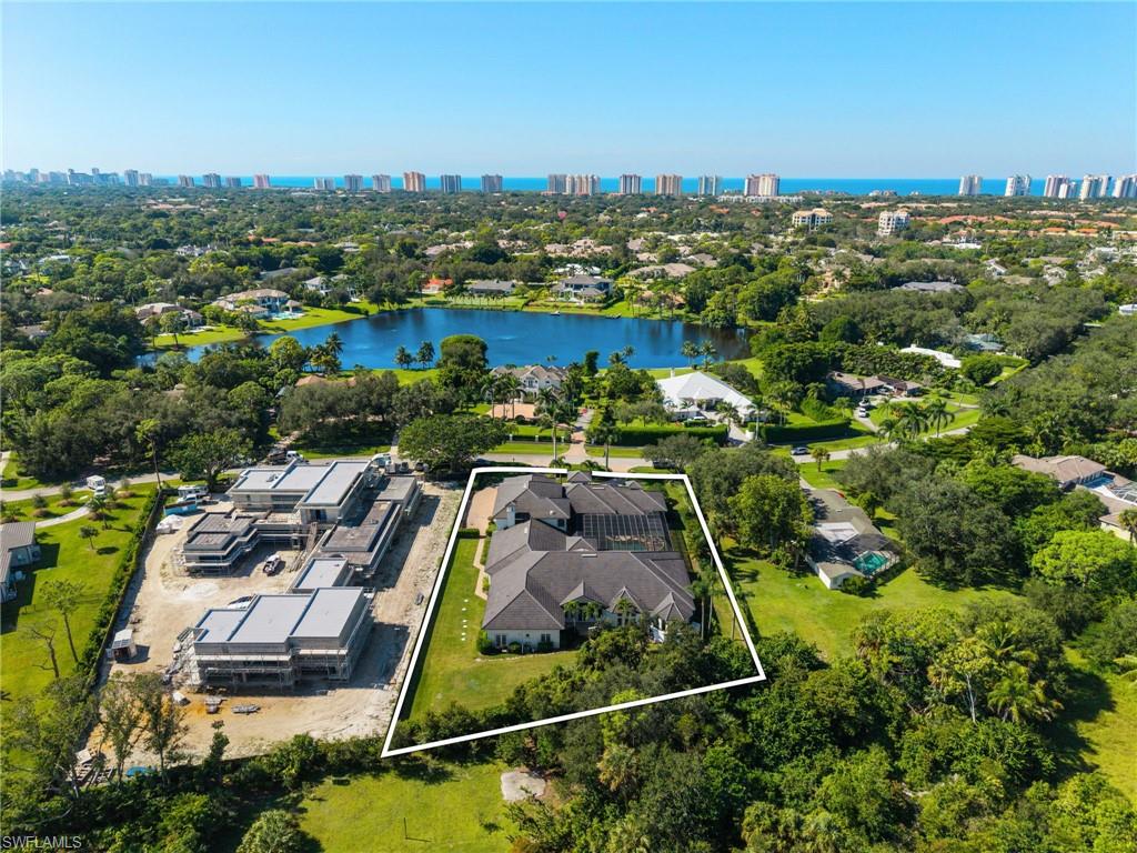 185 Tupelo Road Naples, FL 34108 - Photo 42 of 44 an aerial view of a house with a garden