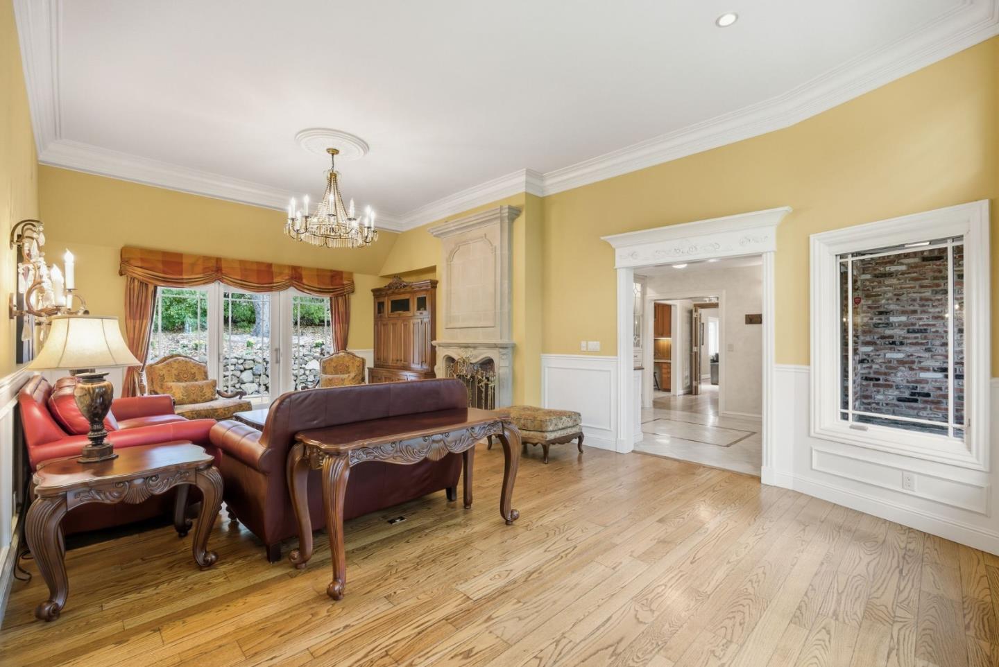 23423 Toyonita Road Los Altos Hills, CA 94024 - Photo 14 of 59 a living room with furniture a chandelier and a dining table
