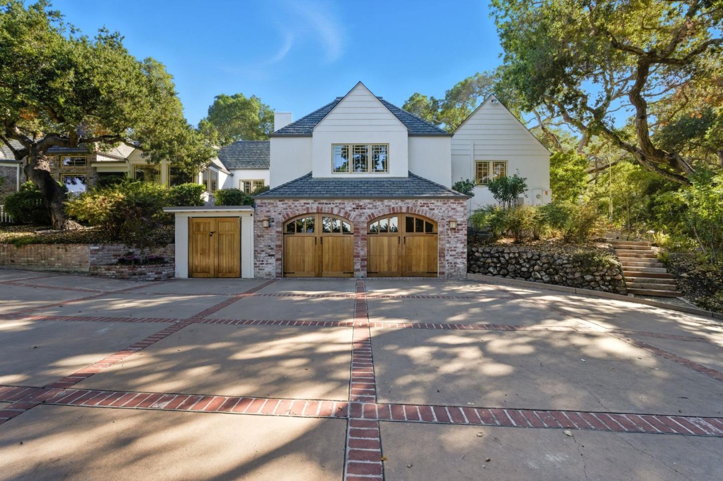 23423 Toyonita Road Los Altos Hills, CA 94024 - Photo 2 of 59 a front view of a house with a yard and garage