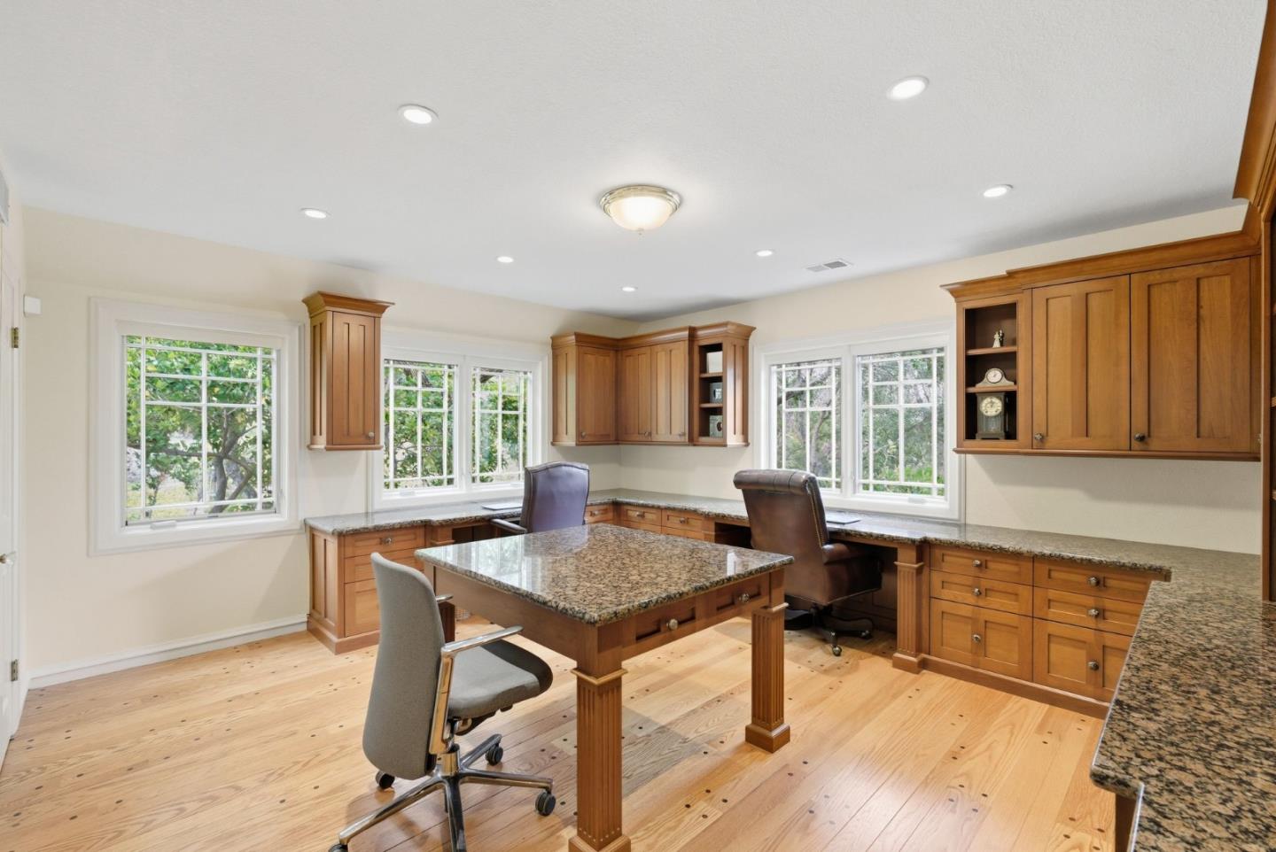 23423 Toyonita Road Los Altos Hills, CA 94024 - Photo 40 of 59 a kitchen with granite countertop kitchen island stainless steel appliances a table and chairs in it