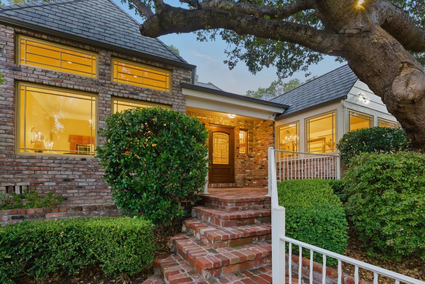 23423 Toyonita Road Los Altos Hills, CA 94024 - Photo 4 of 59 a view of a porch with a floor to ceiling window and potted plants