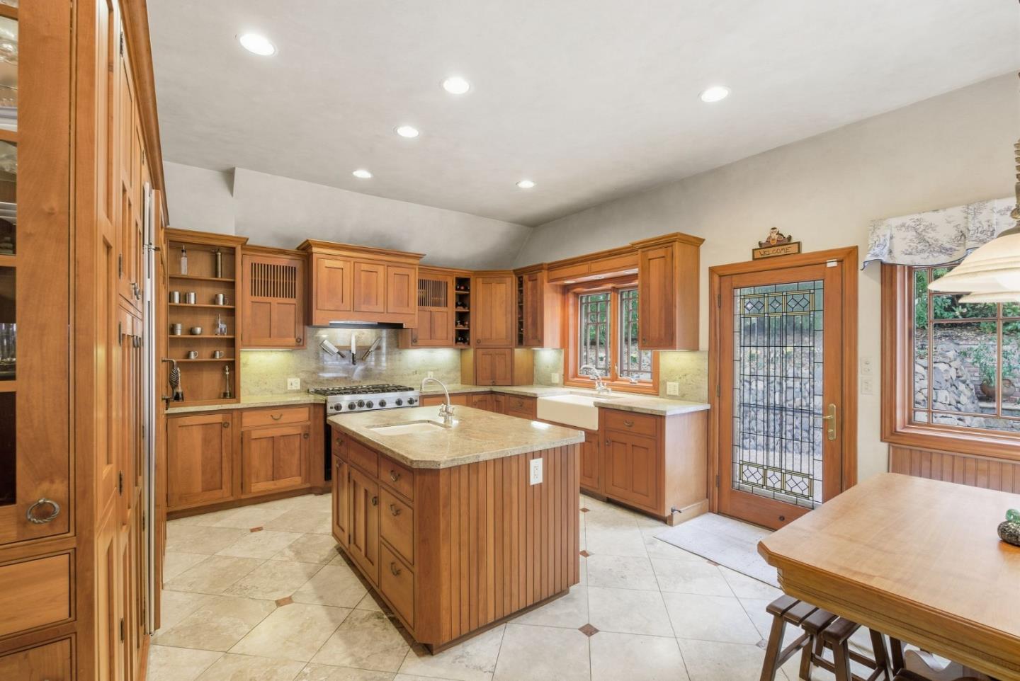 23423 Toyonita Road Los Altos Hills, CA 94024 - Photo 9 of 59 a kitchen with a stove a refrigerator and a stove top oven