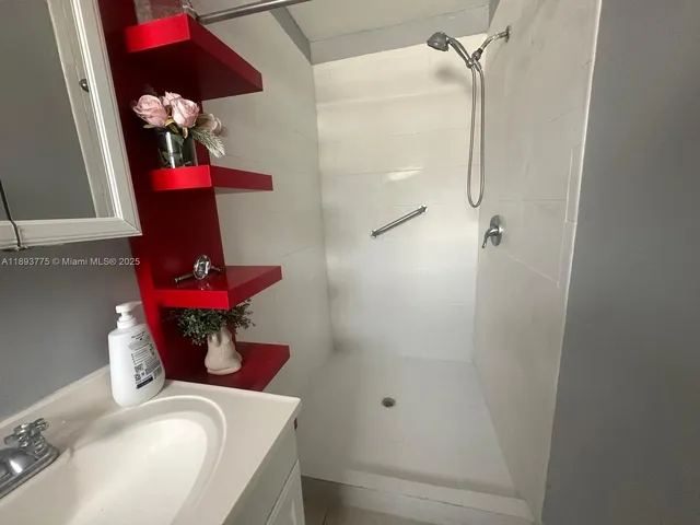 a white toilet sitting next to a bathroom sink