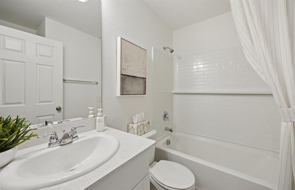 14069 Ladbroke Street Pilot Point, TX 76258 - Photo 11 of 14 Upgraded secondary bath with elegant finishes *Model representation