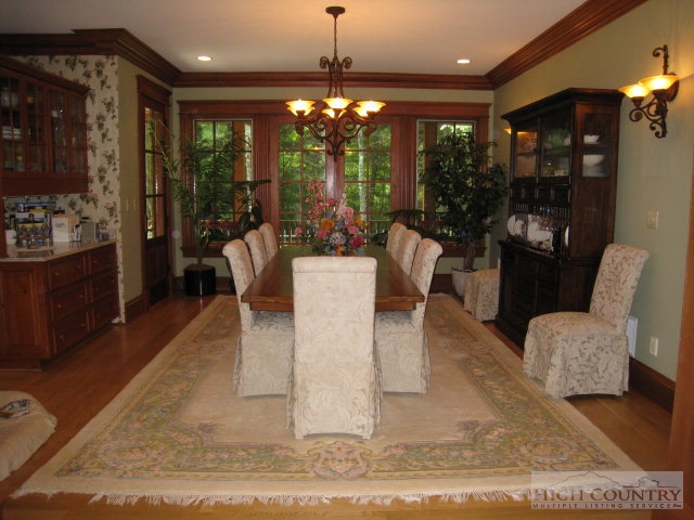 500 Manor Ridge Boone, NC 28607 - Photo 11 of 17 a view of a dining room with furniture wooden floor and chandelier