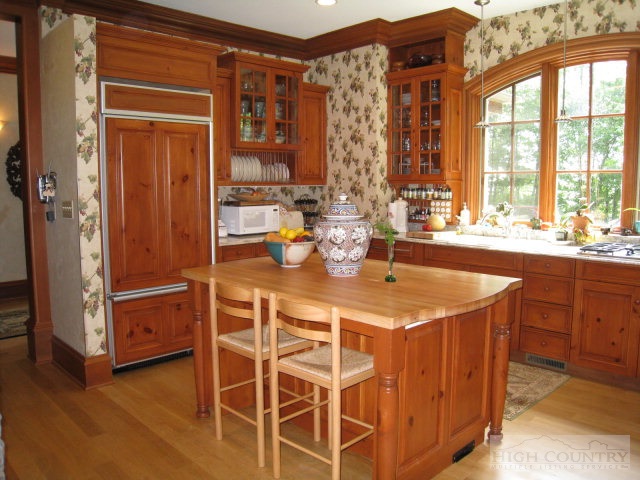 500 Manor Ridge Boone, NC 28607 - Photo 13 of 17 a dining room with a window and wooden floor