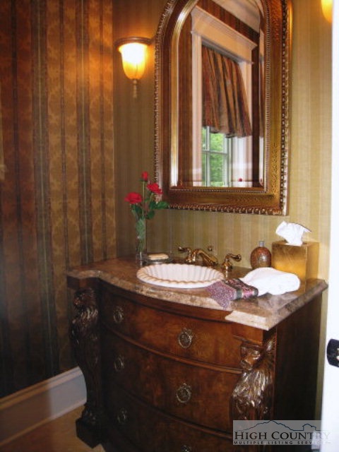 500 Manor Ridge Boone, NC 28607 - Photo 5 of 17 a bathroom with a sink and a mirror