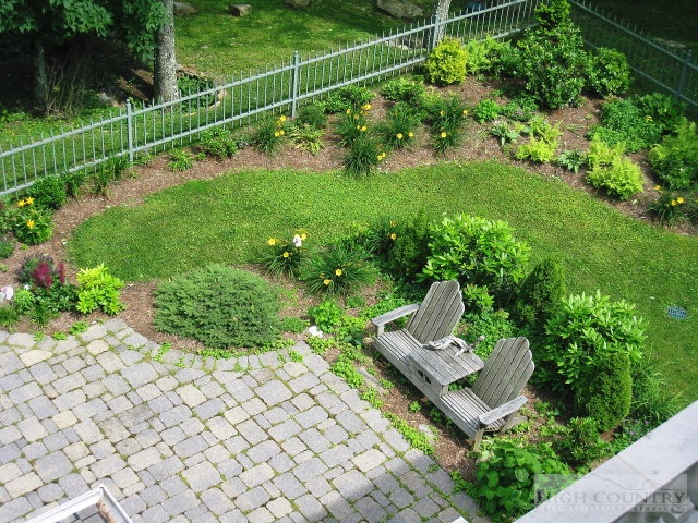 500 Manor Ridge Boone, NC 28607 - Photo 8 of 17 a view of a garden with a bench