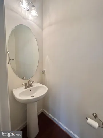 a bathroom with a sink a mirror and vanity
