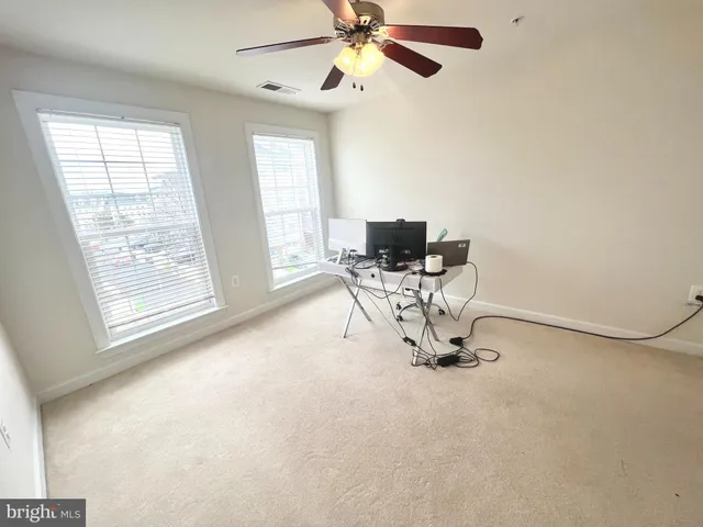 a view of a hallway with staircase