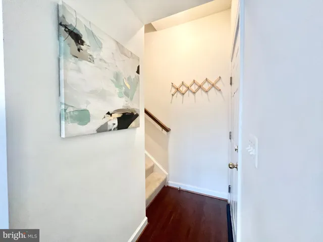 a view of a balcony with wooden floor and a window