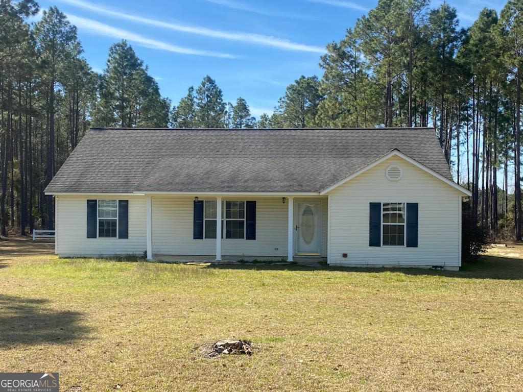 50 Oak View Road Hazlehurst, GA 31539 - Photo 1 of 1 a house with trees in the background