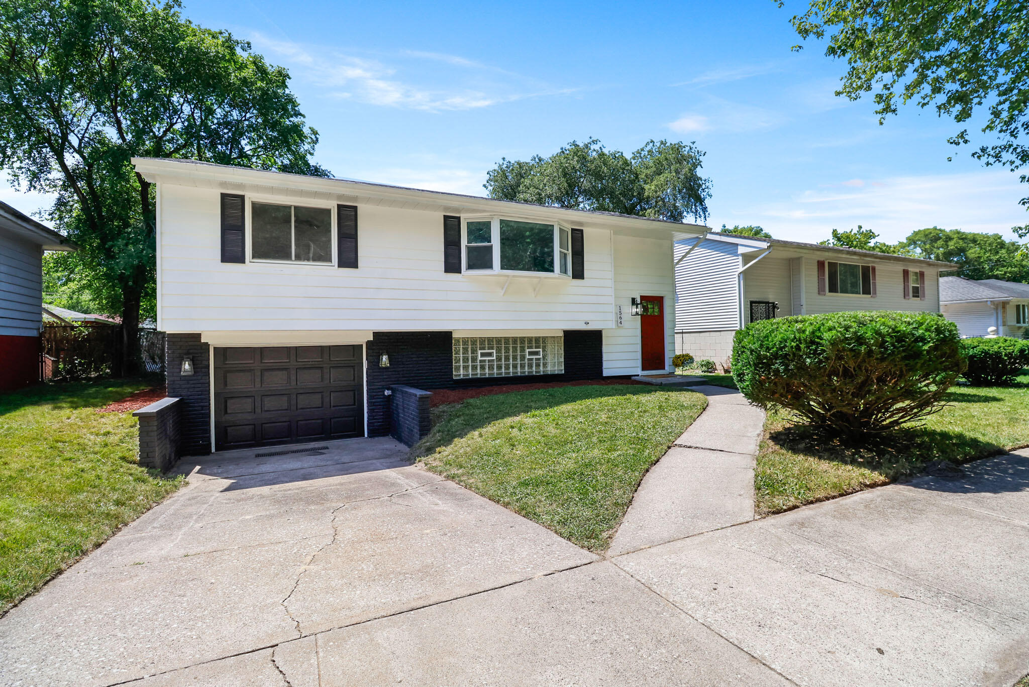 1564 Clinton Street Gary, IN 46406 - Photo 1 of 27 a house view with a garden space