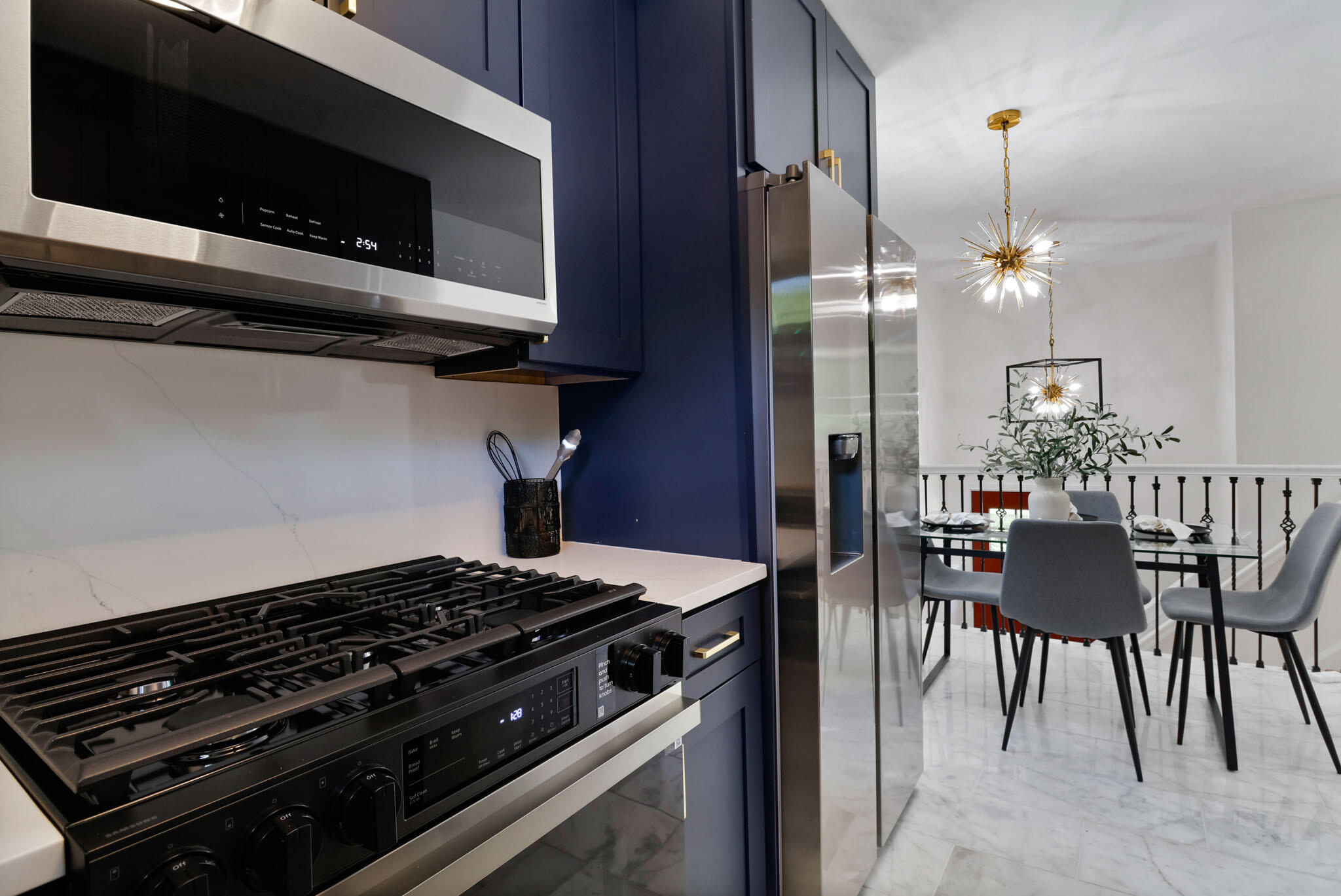 1564 Clinton Street Gary, IN 46406 - Photo 11 of 27 a kitchen with a stove and a microwave