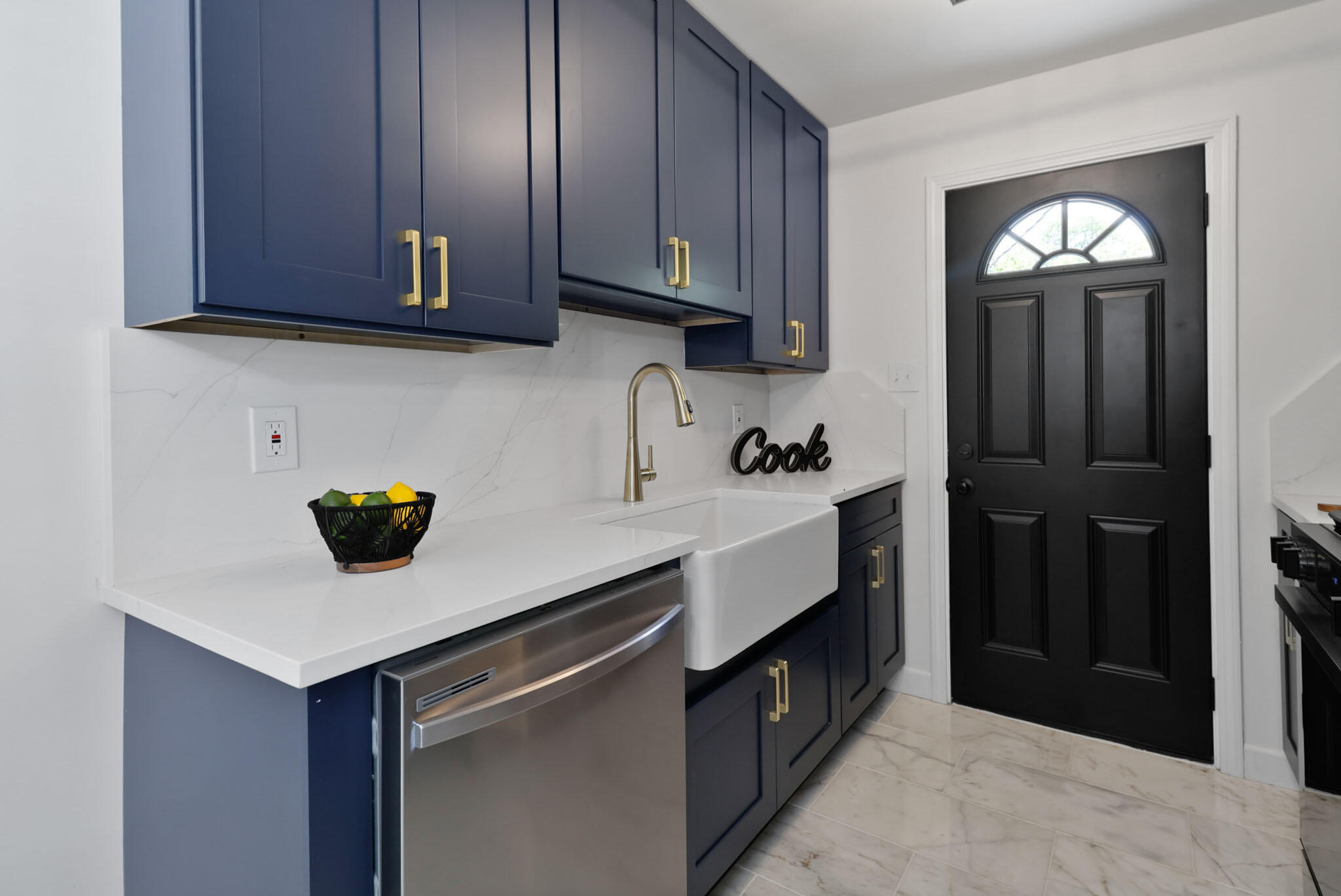 1564 Clinton Street Gary, IN 46406 - Photo 12 of 27 a kitchen with stainless steel appliances granite countertop a sink a stove and cabinets