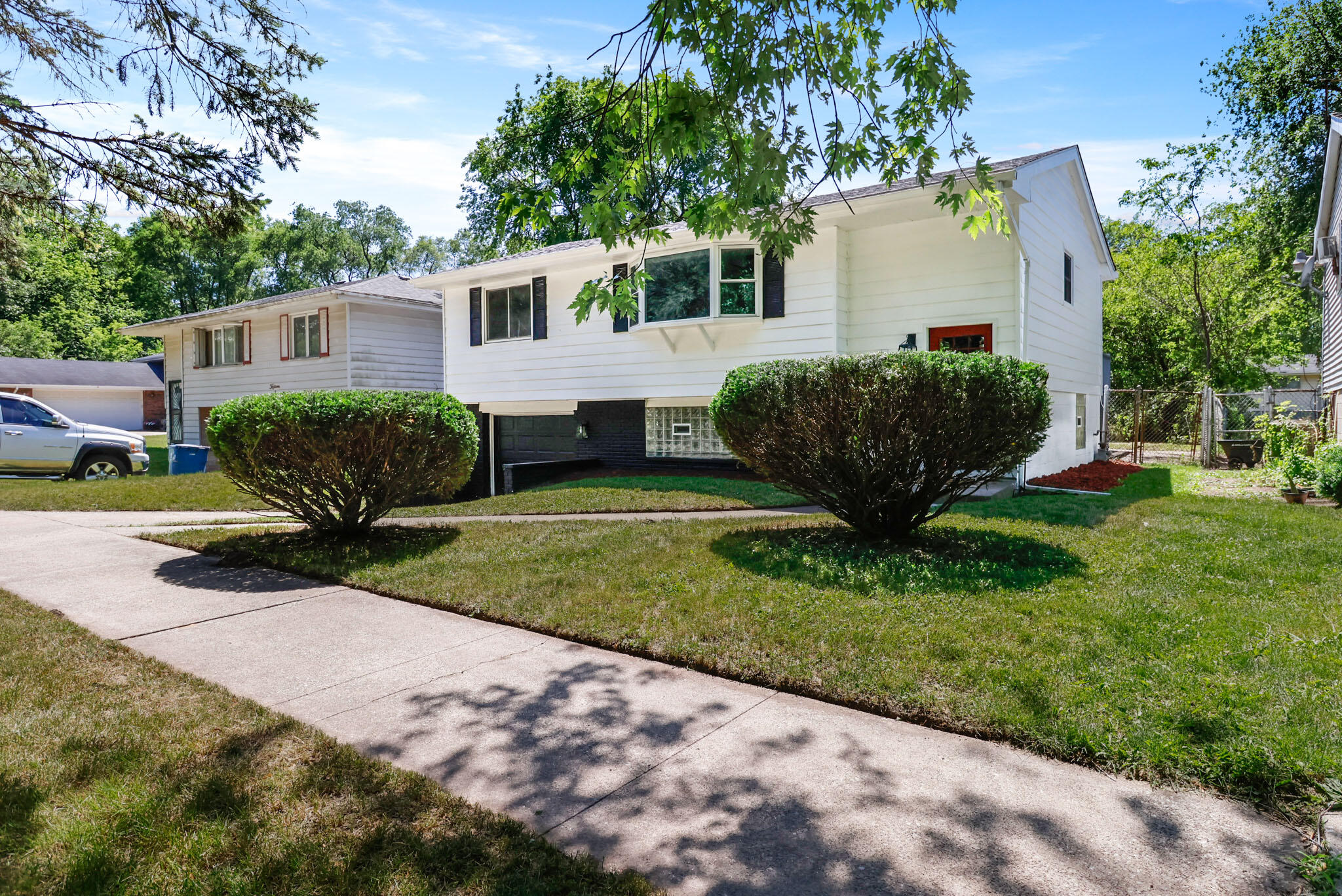1564 Clinton Street Gary, IN 46406 - Photo 2 of 27 a view of a house with backyard and a garden