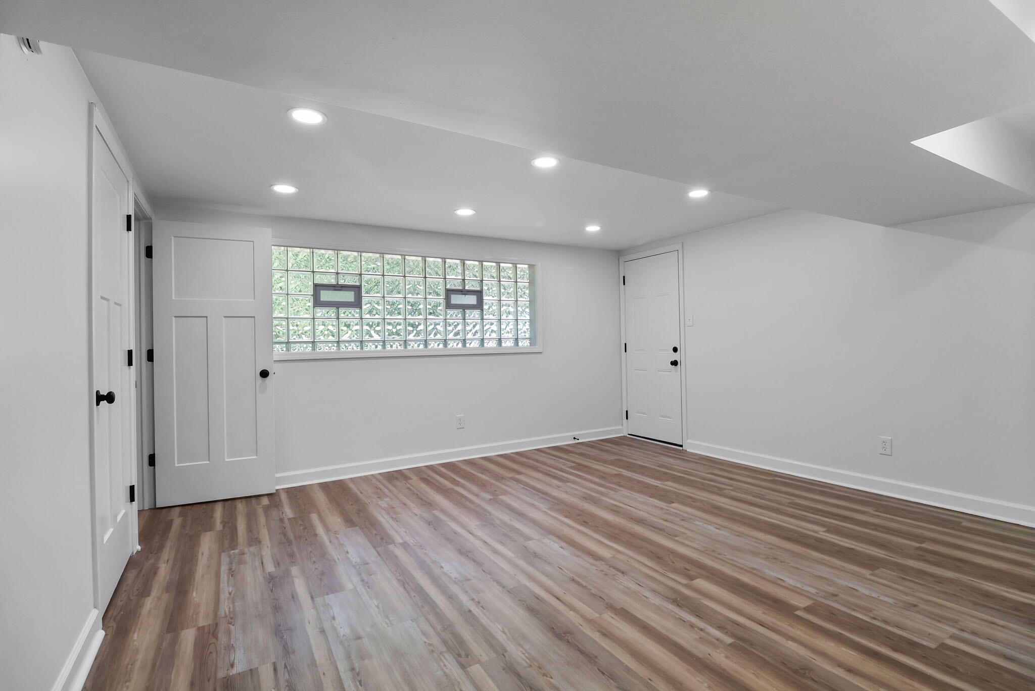 1564 Clinton Street Gary, IN 46406 - Photo 22 of 27 a view of an empty room with wooden floor and a window