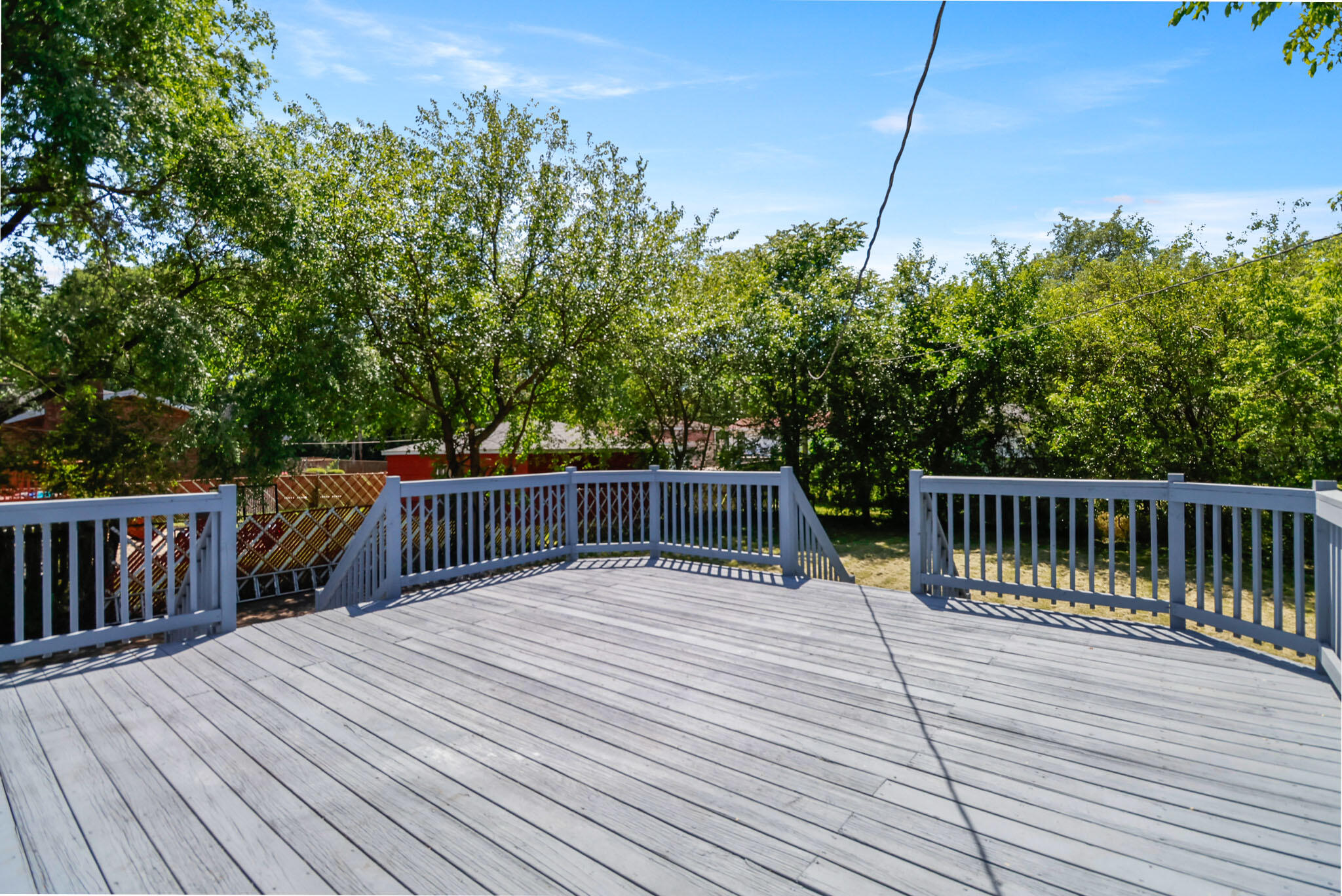 1564 Clinton Street Gary, IN 46406 - Photo 25 of 27 a balcony with wooden floor and fence