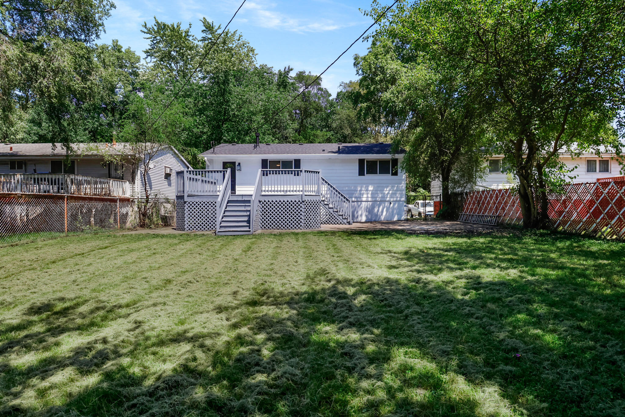 1564 Clinton Street Gary, IN 46406 - Photo 26 of 27 a front view of house with yard and trees in the background