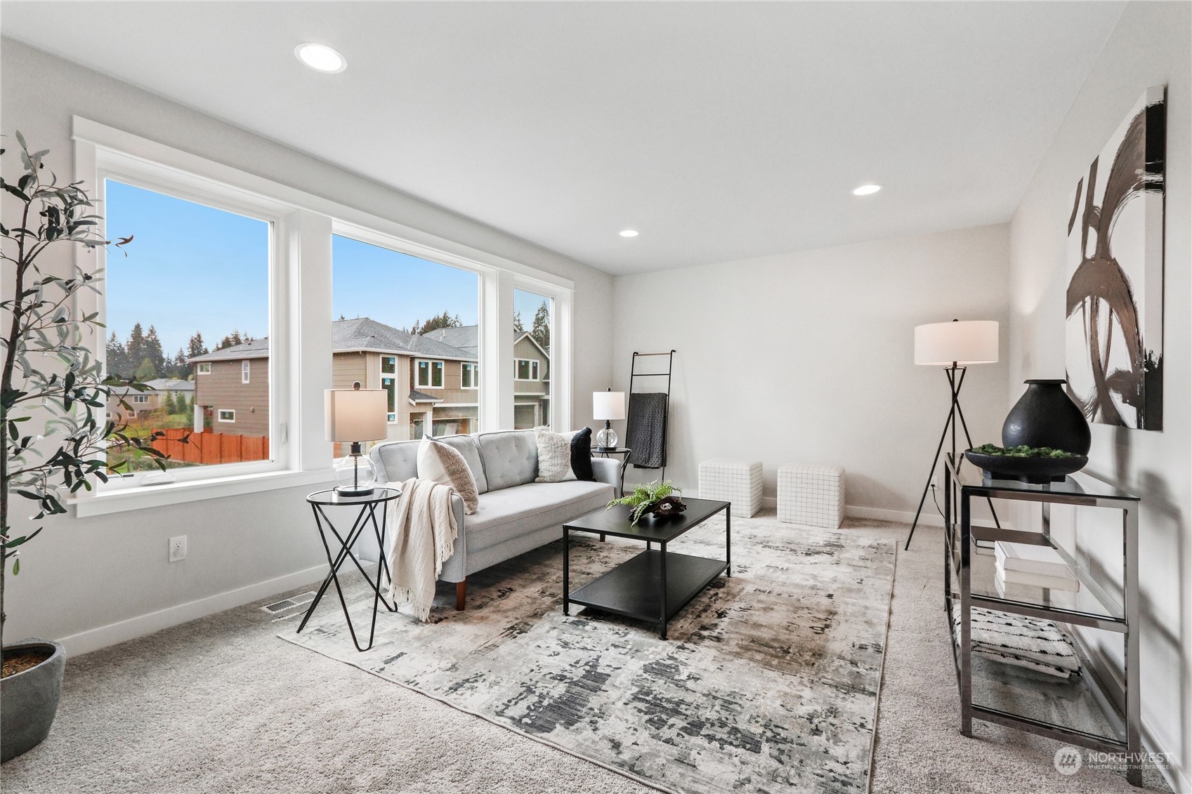 3904 211th Place Southeast Bothell, WA 98021 - Photo 15 of 24 a living room with furniture and a large window