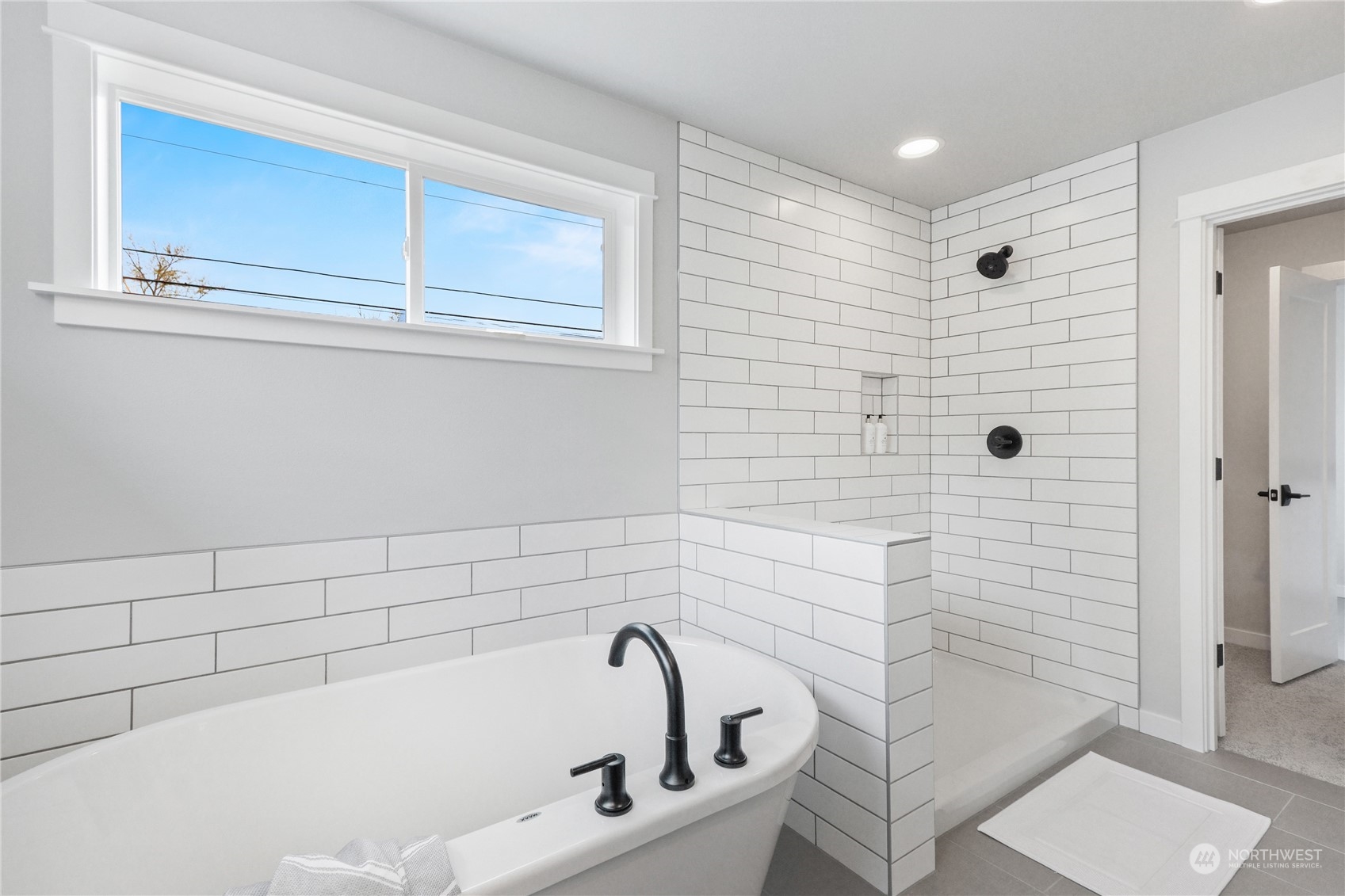 3904 211th Place Southeast Bothell, WA 98021 - Photo 20 of 24 a bathroom with a bathtub and shower