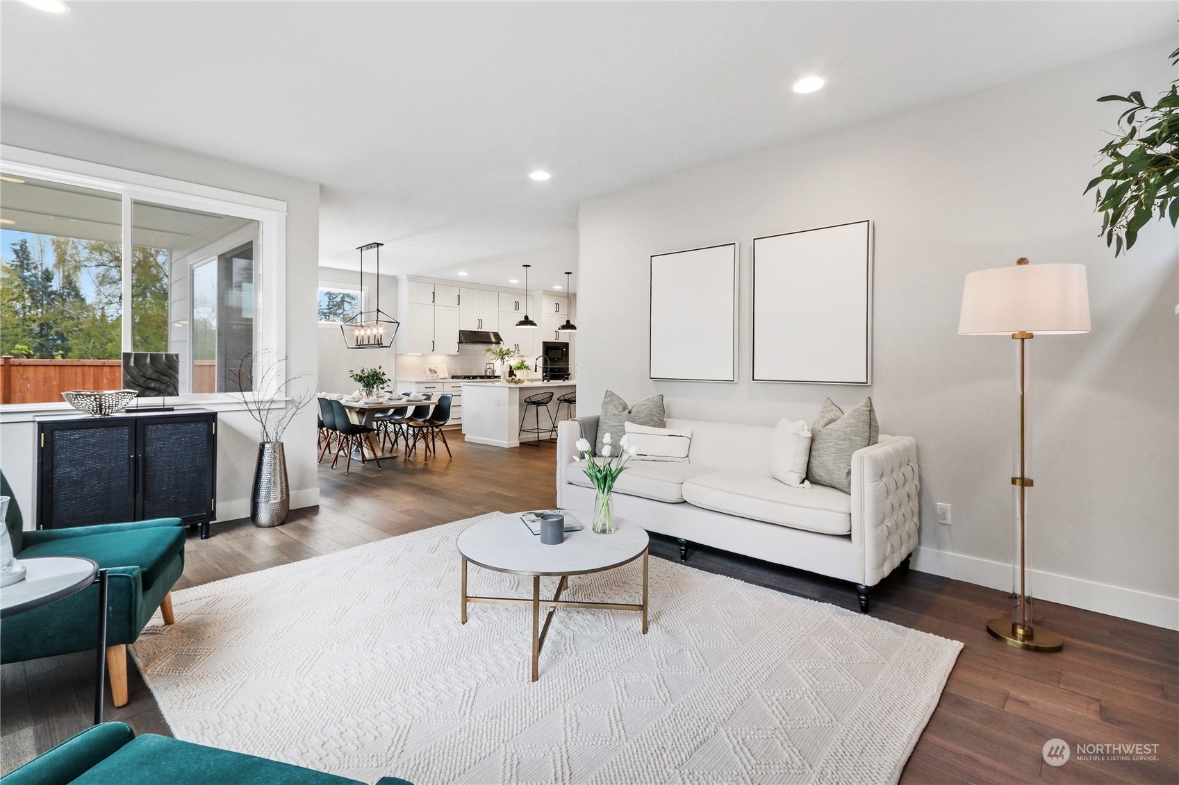 3904 211th Place Southeast Bothell, WA 98021 - Photo 5 of 24 a living room with furniture a lamp and a table