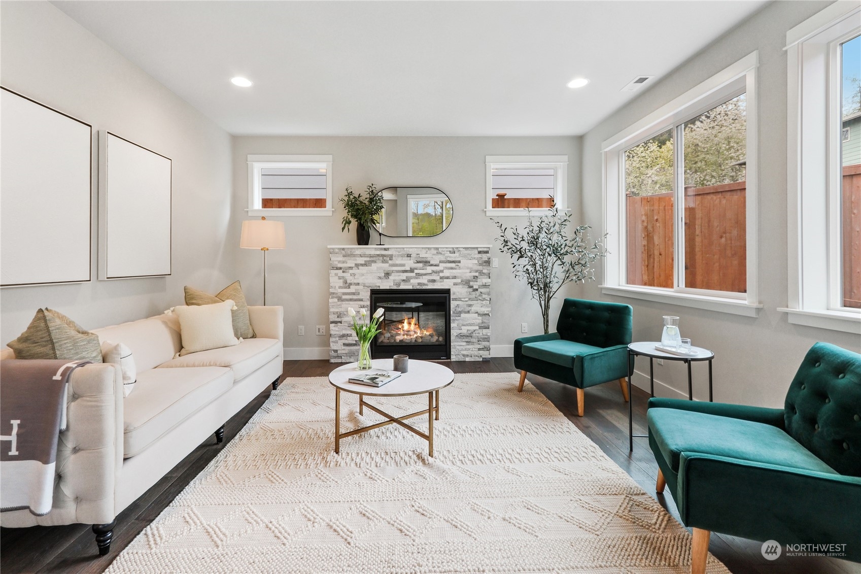 3904 211th Place Southeast Bothell, WA 98021 - Photo 7 of 24 a living room with furniture and a fireplace
