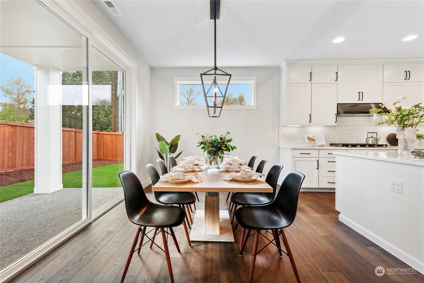 3904 211th Place Southeast Bothell, WA 98021 - Photo 8 of 24 a view of a dining room with furniture window and wooden floor