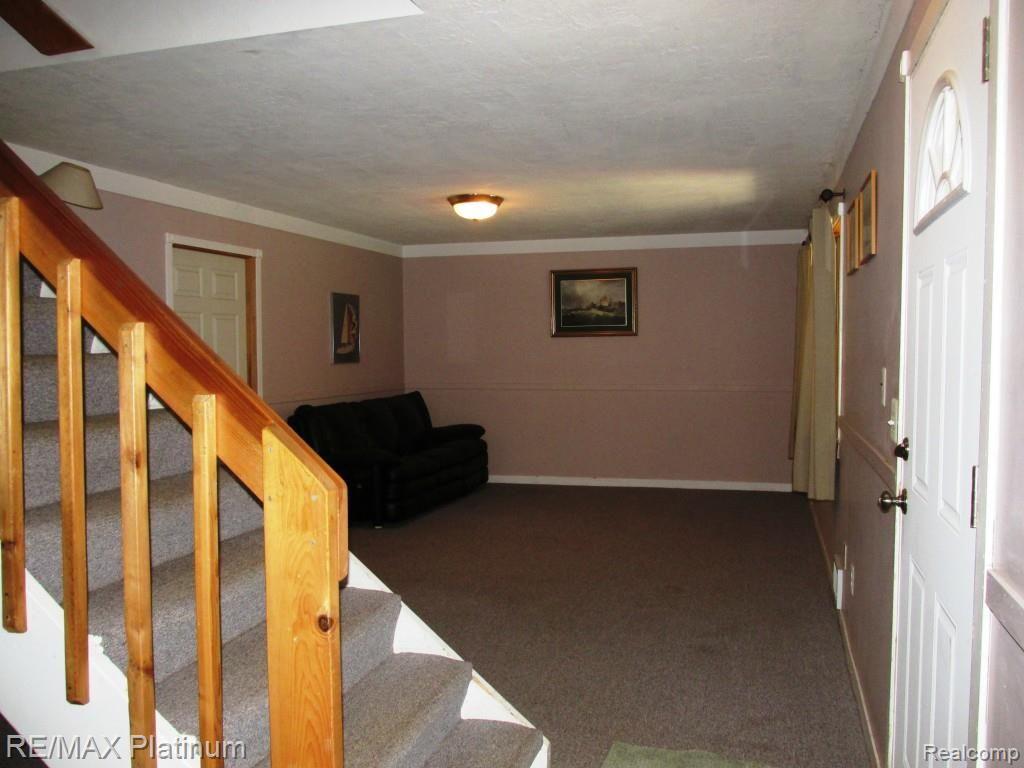 12296 Rohn Road Fenton, MI 48430 - Photo 28 of 38 13 X 40' REC ROOM IN WALKOUT LOWER LEVEL HAS POTENTIAL FOR 4TH BEDROOM.