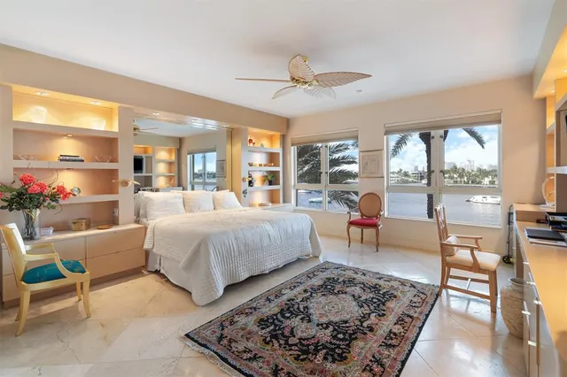 a living room with furniture and a dining table