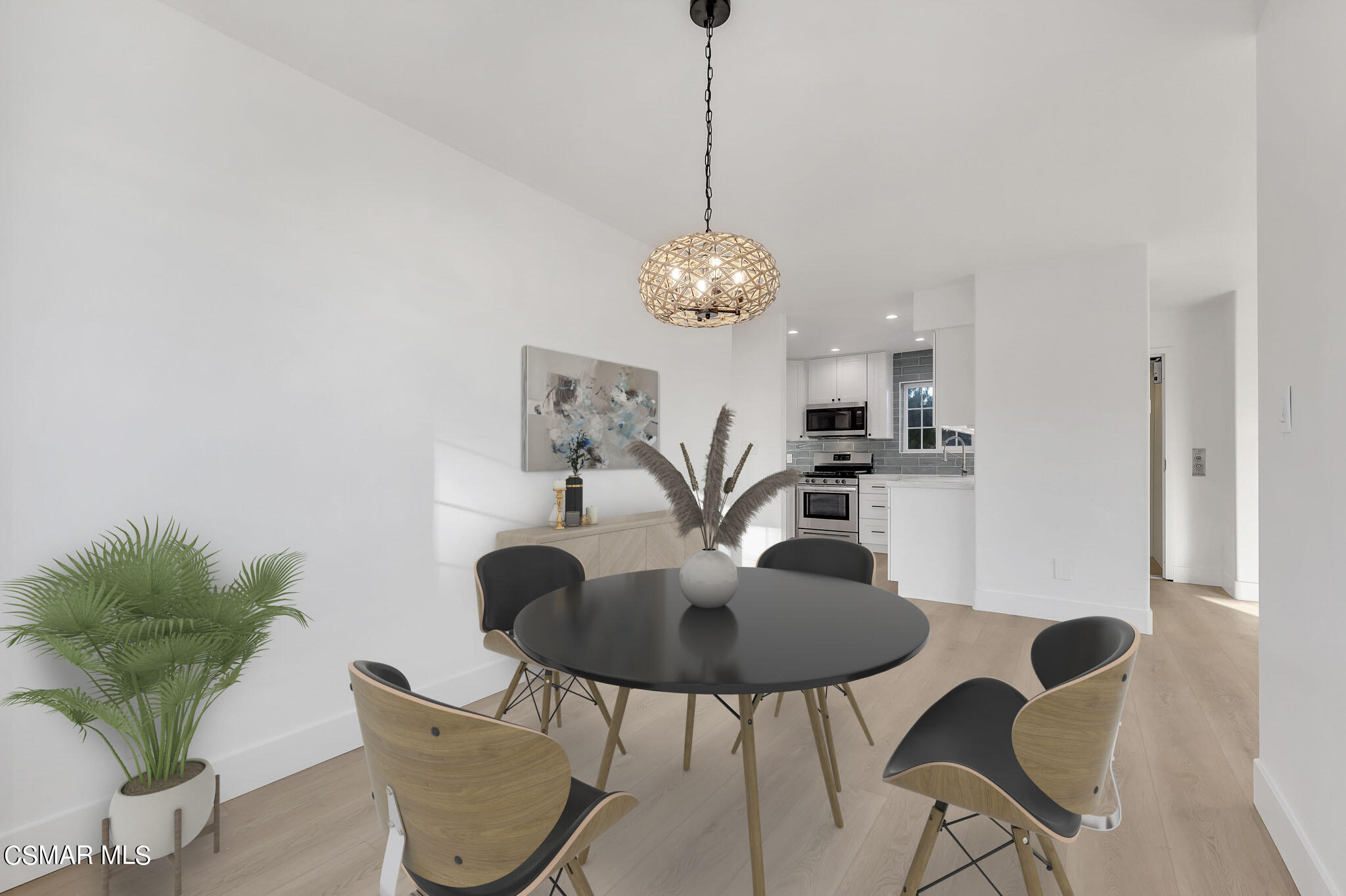 5222 West Wooley Road Oxnard, CA 93035 - Photo 12 of 39 a dining room with furniture and a chandelier