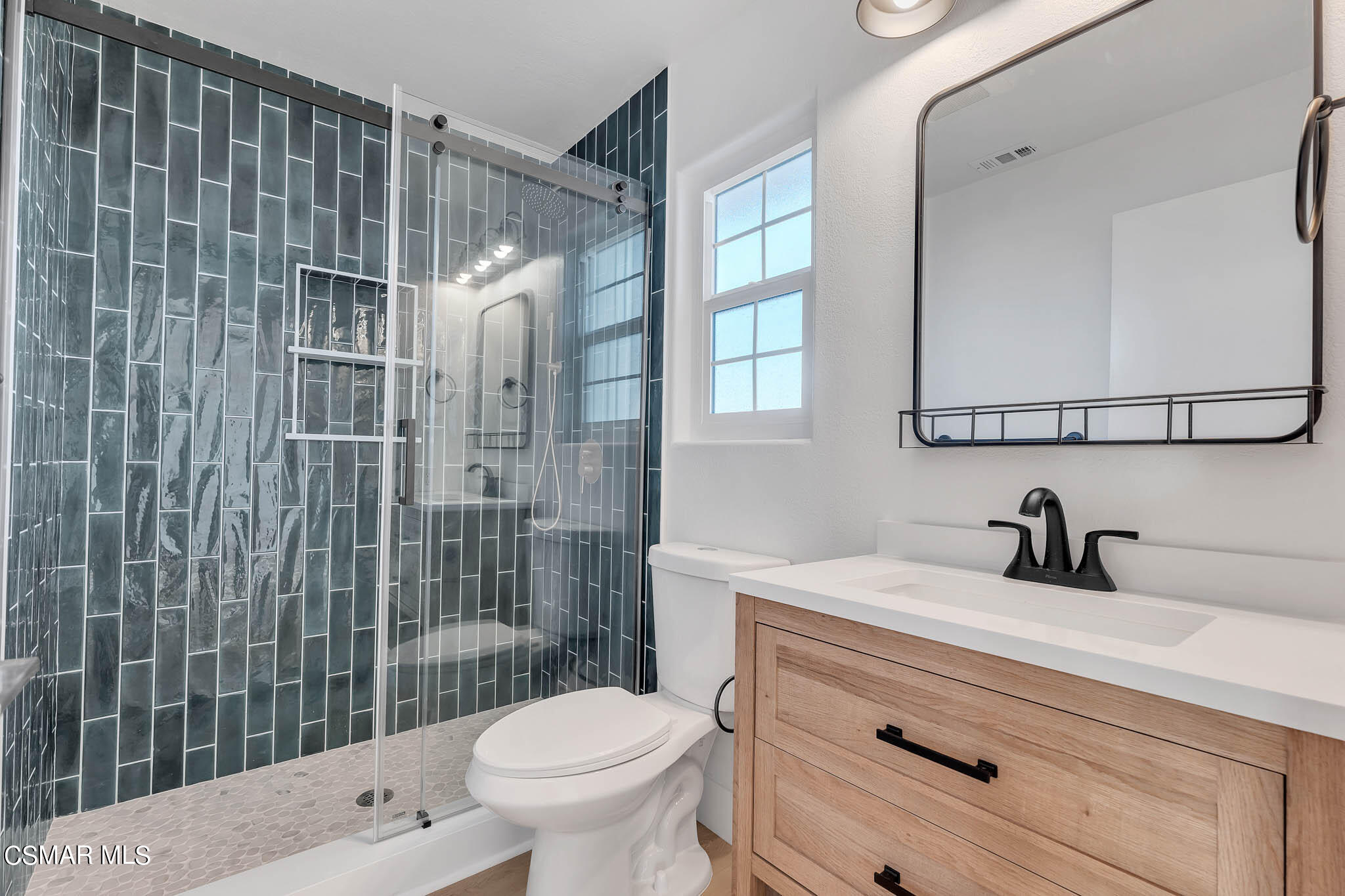 5222 West Wooley Road Oxnard, CA 93035 - Photo 27 of 39 a bathroom with a sink a toilet and shower