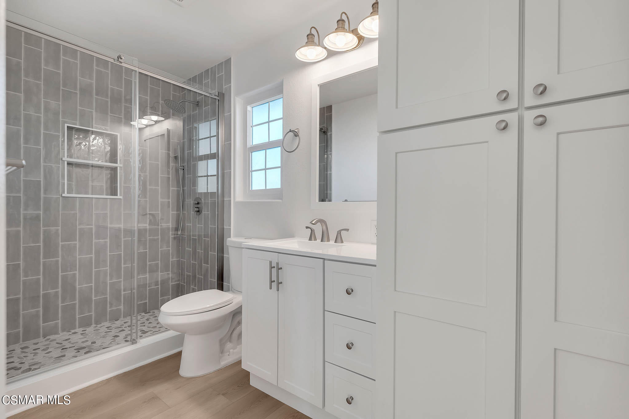 5222 West Wooley Road Oxnard, CA 93035 - Photo 30 of 39 a bathroom with a sink a toilet and shower