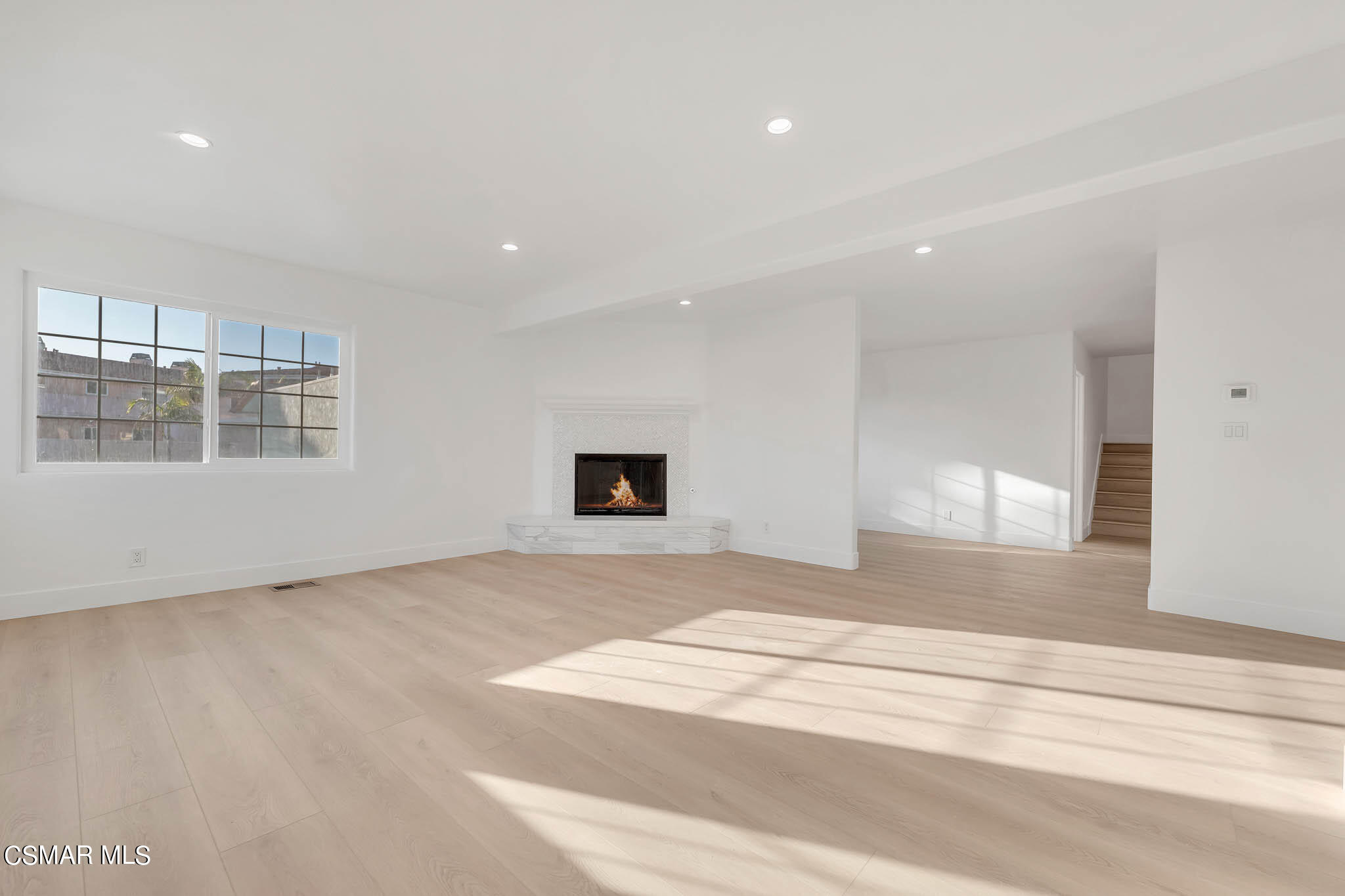 5222 West Wooley Road Oxnard, CA 93035 - Photo 10 of 39 a view of an empty room with wooden floor and a window