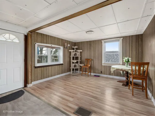a bedroom with furniture and a window